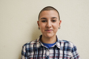 Young bald girl looking on camera