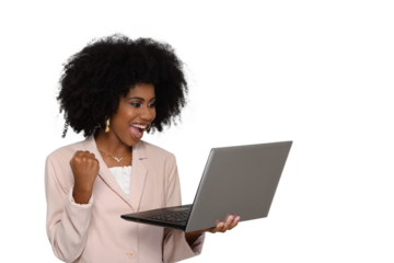 woman holding laptop computer with closed hand celebrating looks at laptop screen