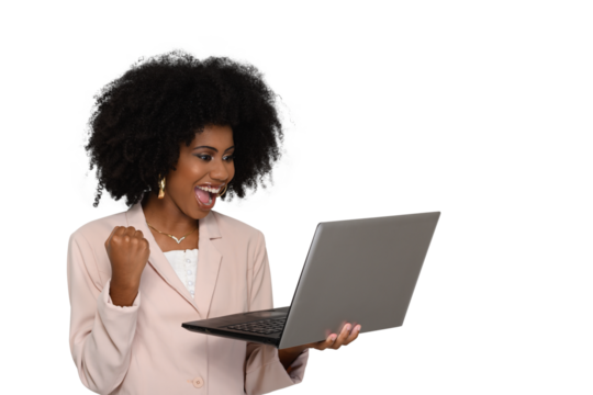 woman holding laptop computer with closed hand celebrating looks at laptop screen