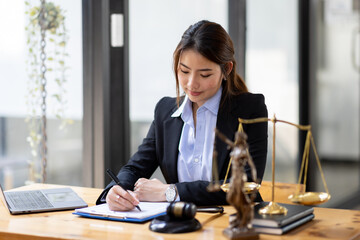 justice and law concept. Lawyer office. Statue of Justice with scales and lawyer Asian Woman...
