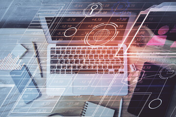 Double exposure of desktop computer and technology theme hologram. Concept of software development.