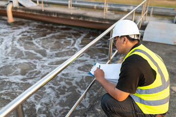 Environmental engineers work at wastewater treatment plants,Water supply engineering working at Water recycling plant for reuse