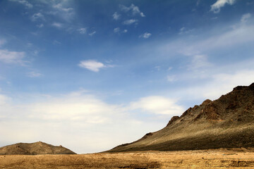 Afghanistan landscape, desert plain against the backdrop of mountains