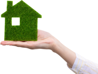 Female hands hold a model of a green house close-up. Sale of ecological real estate of the future.