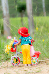 beautiful baby girl with a bicycle