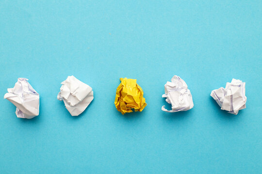 crumpled yelllow paper as a concept creative idea and innovation