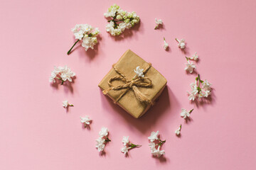 lilac flowers with eco gift box from kraft paper. Creative congratulations layout. Spring flower concept.
