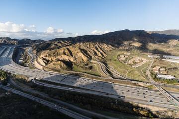 Aerial view of the Interstate 5 freeway and Los Angeles aqueduct cascades near the San Fernando Valley and Santa Clarita in Southern California.  