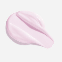 Pink beauty cream smear smudge on white background. Cosmetic skincare product texture. Face cream, body lotion swipe swatch