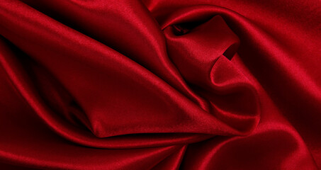 Smooth elegant red silk or satin luxury cloth texture as abstract background. Luxurious valentines day background design