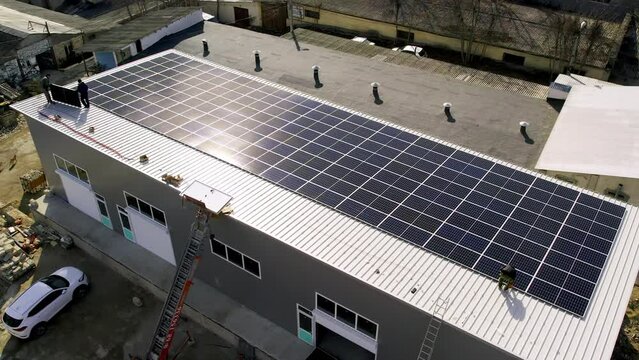 Modern Solar Panels Produce Clean Electricity. Solar Technician Installing Solar Panels On House Roof. Concept.renewable Energy, Technology, Electricity, Service, Green, Future. Power Plant. 