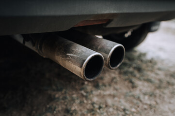 Two carbon fiber exhaust pipes of a sports car close-up. Photography, tuning.