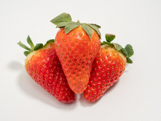 Ripe strawberries on a white background. Strawberries close up.