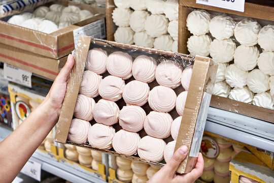 Pack of marshmallow in hands of buyer