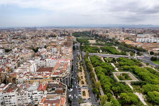 Aerial drone view of sunrise over Turia Gardens, a riverbed turned into a park, in Valencia, Spain