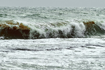 View of storm seascape. Green wavy sea water