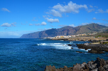 View of the ocean rocky coast and cliffs of Los Gigantes in the distance from...