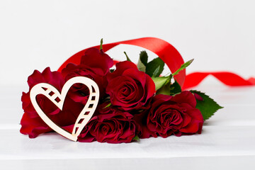 Valentines day red roses with decor on white table