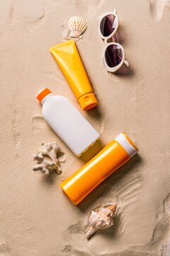 Sunblock lotion bottles and sunglasses