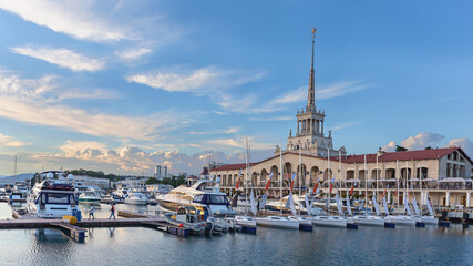 a small sailing boats in  Sochi sea port on a background marine station