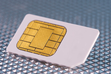 SIM-Card / SIM-Karte auf einem technischen Hintergrund (Alu / Metall)