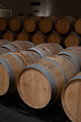 Rows of french and american oak barrels in cellars of winery in Rioja wine making region, Spain