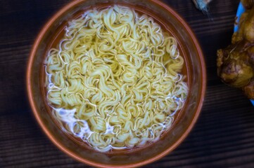 instant noodles in a clay plate