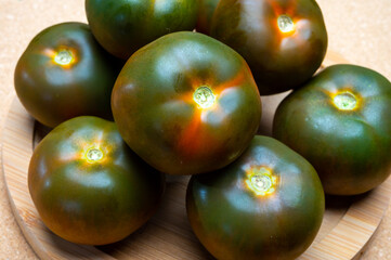 Fresh ripe sweet reddish brown and green kumato tomatoes