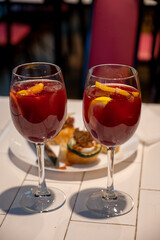 Glass of cold sangria wine served in old bar in San Sebastian, Basque Country, Spain