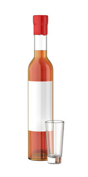 Tall bottle with brandy or whisky and an small empty glass cup