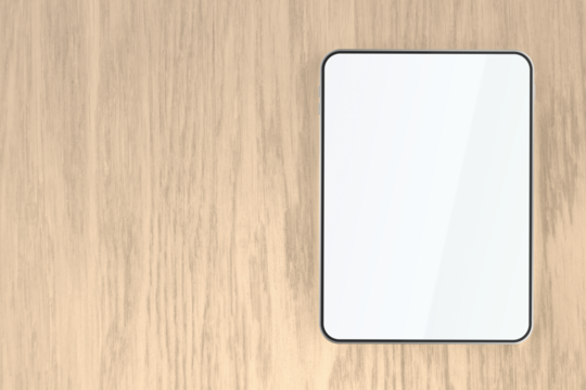 Tablet with empty screen on wooden desk, top view