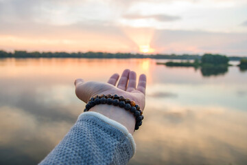 Bracelet made of natural stone on hand