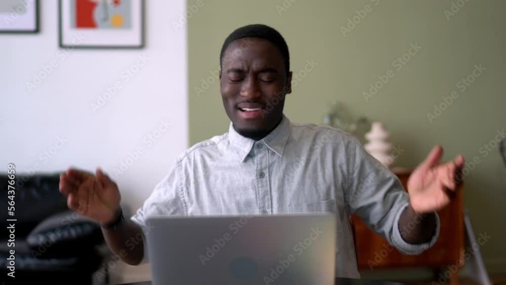 Poster black male programmer shocked with received laptop notification for data app on computer, amazed afr