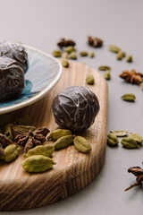 Chocolate candies with spices. Tasty sweet truffles. Vertical