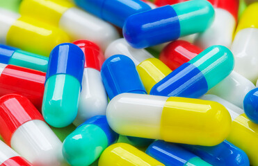 Background of pills of different colors from different viruses