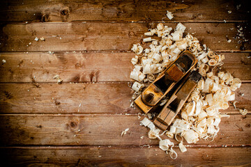 Working tool. Planer with wooden shavings. 