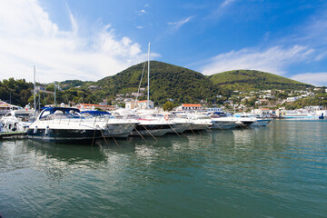 Fototapeta na wymiar Boats in marina, view of Ischica, Italy. Italian Islands.
