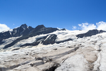 Fototapeta na wymiar Mountain Grossglockner panorama and glacier Pasterze with icefall Hufeisenbruch and crevasses in Glockner Group, Austria