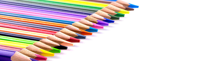 Obraz premium A set of color pencils isolated on a white background. Copy space. A School stuff.Drawing supplies.Banner