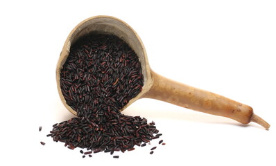 Black rice uncooked in calabash isolated on white, side view