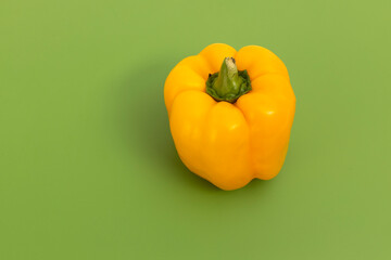 Vegetables on green professional chopper - yellow pepper isolated