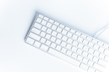 Keyboard White wireless computer keyboard isolated on white background. English keyboard layout