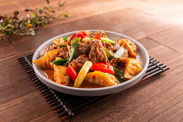 Farmhouse Spicy Duck Dumplings with tomato served dish isolated on wooden table top view of Hong Kong food