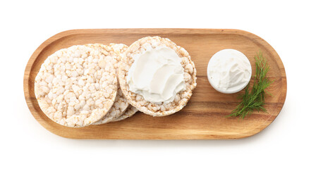 Wooden board with tasty crispbreads and bowl of cream cheese on white background