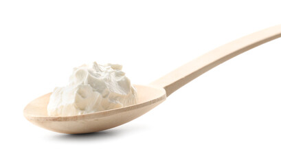 Wooden spoon with tasty cream cheese on white background, closeup