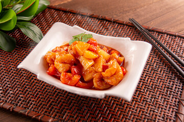 Sesame Shrimp Roll Spicy Stir-Fry and Sweet and Sour Sauce served dish isolated on wooden table top view of Hong Kong food