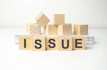 Issue word on wooden cubes. Issue concept