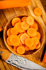 Round pieces of fresh carrots on a plate. 