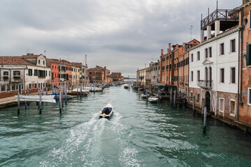 boat navigating on the grand canal in Venice, Italy