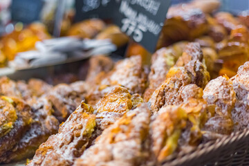 Assortment of freshly baked pastry for sale on counter of shop, grocery, market, cafe or bakery. Dessert, food and traditional french cuisine concept